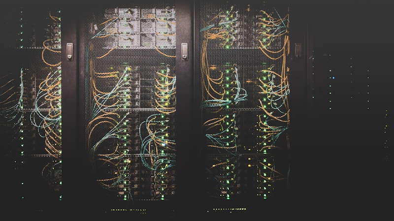 Rows of servers in a modern data center with blue indicator lights