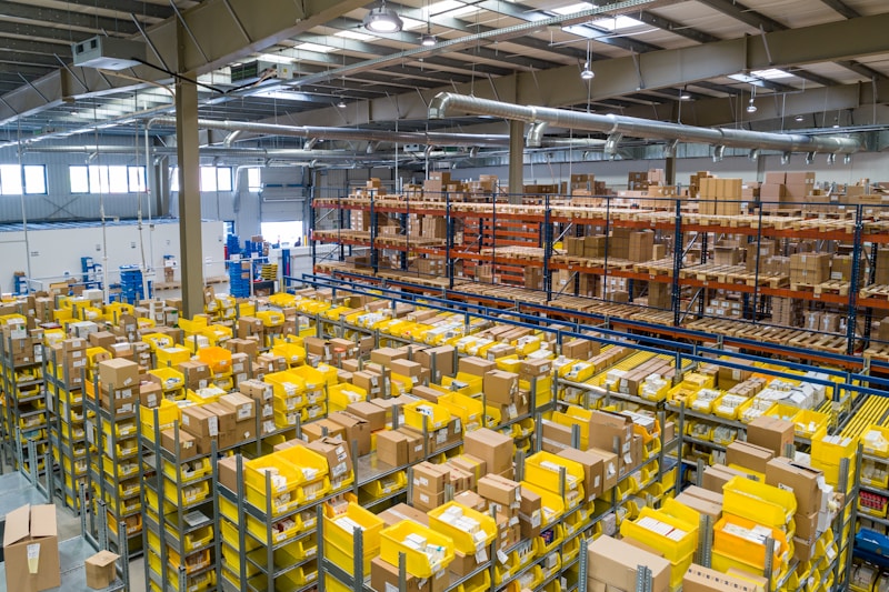 Large warehouse with tall shelving racks and organized inventory for logistics operations